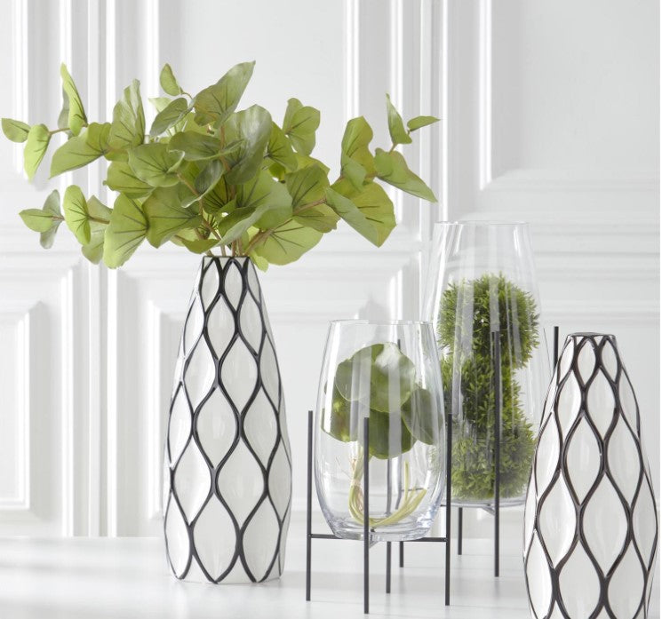Clear Glass Floating on Dark Metal Stands