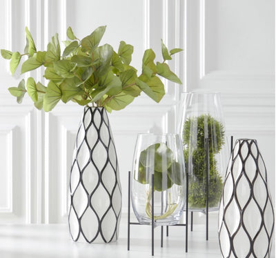 Clear Glass Floating on Dark Metal Stands